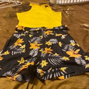 Black floral shorts and yellow tank